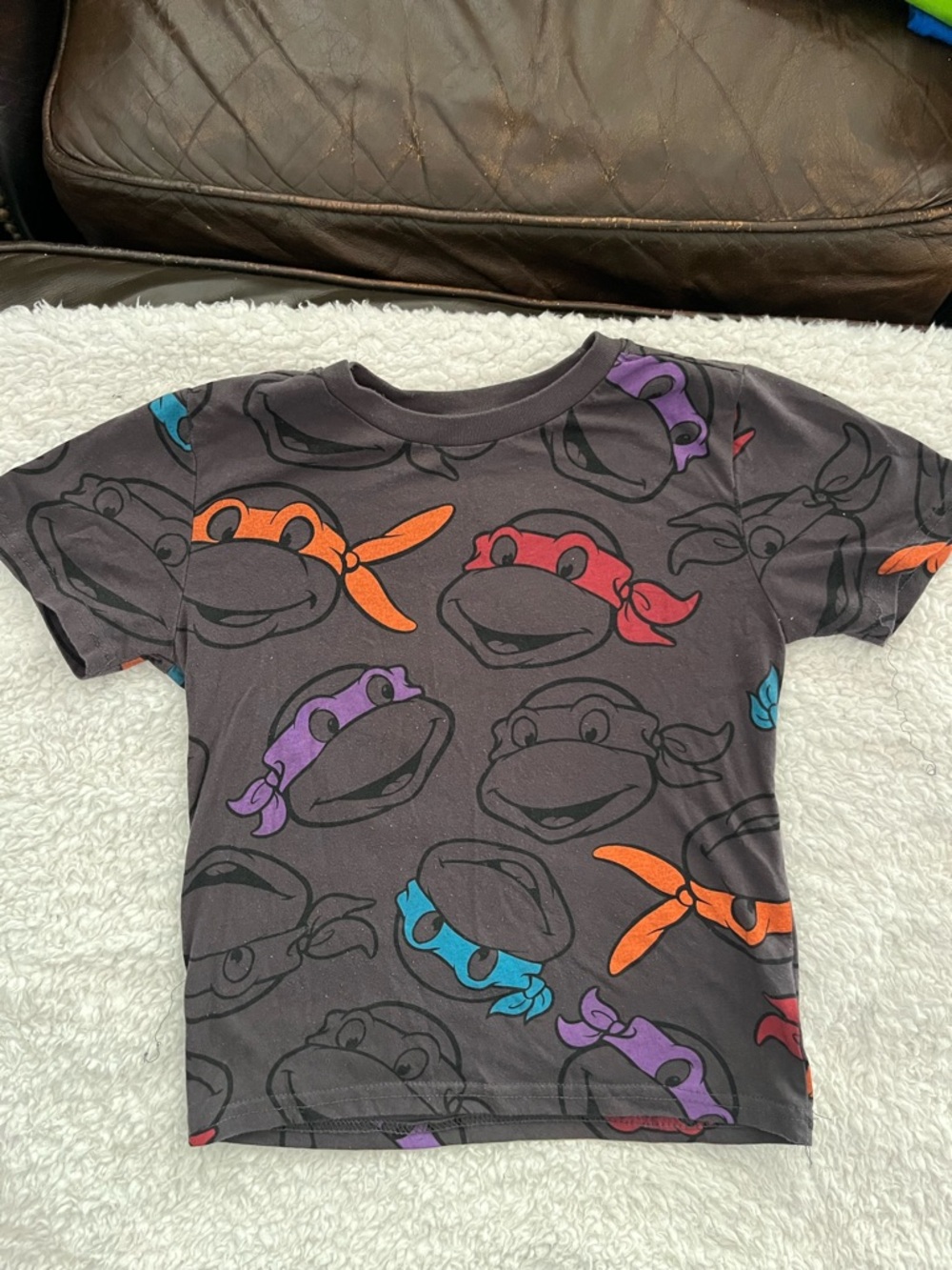 Nickelodeon Black Tee with Red, Orange, Purple & Blue Ninja Faces